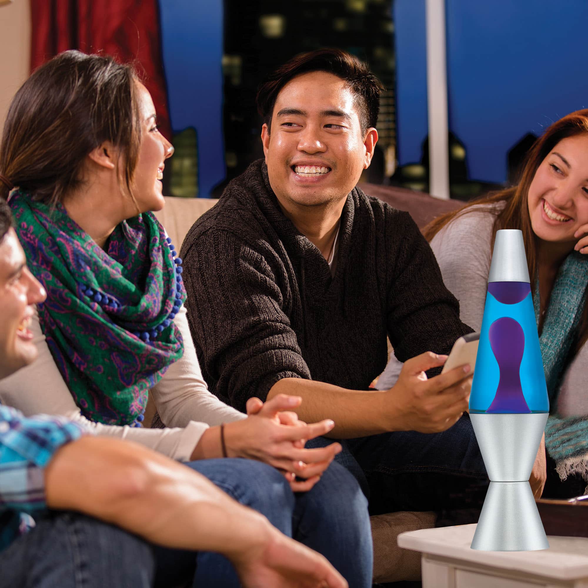 14.5" LAVA� Lamp - Purple/Blue/Silver on a coffee table at a party