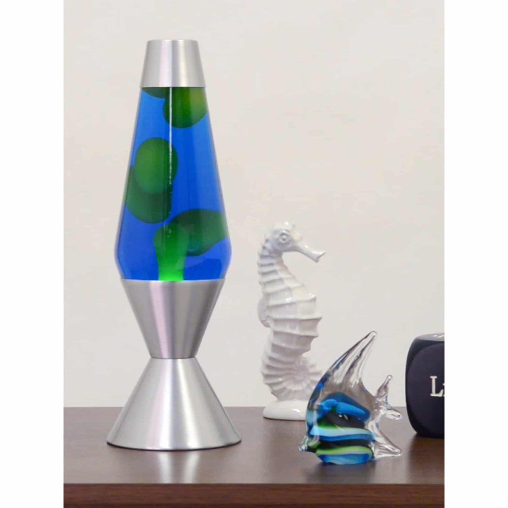 16.3" LAVA� Lamp - Yellow/Blue/Silver on a table with ocean themed knick knacks