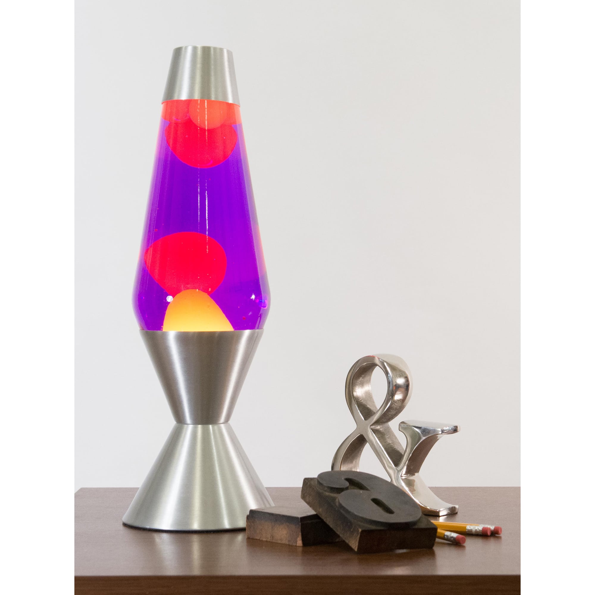 16.3" LAVA� Lamp - Yellow/Purple/Silver on a table with knick knacks